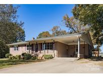 Ranch style house with carport and landscaping at 961 Shallowbrook Dr, Chester, SC 29706