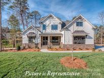 Two story home with white exterior and a large front yard at 3438 Stags Leap Way, York, SC 29745