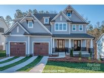 Two-story home with gray siding and a two-car garage at 18148 Kalabash Rd, Charlotte, NC 28278