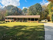 Ranch-style brick home with detached garage and spacious yard at 206 Bayberry Dr, Salisbury, NC 28147