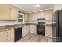 Kitchen with granite countertops and black appliances at 2255 Sides Rd, Rockwell, NC 28138