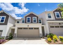 Townhouse exterior with attached garage and landscaping at 14905 Tamarack Dr, Charlotte, NC 28278