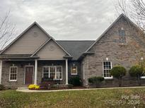 Brick ranch home with a large front yard and mature landscaping at 1820 31St Avenue Ne Ln, Hickory, NC 28601