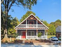 Two-story house with a balcony and front porch at 1703 Polk St, Monroe, NC 28110