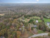 Aerial view of property, including home and outbuildings at 2830 Sparrow Springs Rd, Gastonia, NC 28052