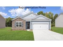 One-story home with stone and gray siding, and a two-car garage at 8039 Plymouth Dr, Sherrills Ford, NC 28673