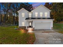 Two-story white house with a two-car garage at 1403 Gentry Pl, Salisbury, NC 28146