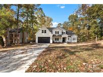 Stunning two-story home with a charming front yard at 7409 Delta Lake Dr, Charlotte, NC 28215