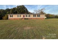 Ranch-style home with large yard and detached shed at 36245 Nugget Rd # 2, New London, NC 28127