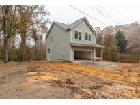 Two-story house with gray siding and a two-car garage at 210 Horseman Dr, Gastonia, NC 28056