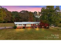 Ranch home with a large yard and mature trees at 5692 Lee Cline Rd, Conover, NC 28613