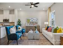 Bright and airy living room with comfy seating and large TV at 8618 Miles Gap Rd, Indian Land, SC 29707