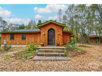 Unique wood home with arched entryway and stone steps at 2224 Taylor Rd, Shelby, NC 28152
