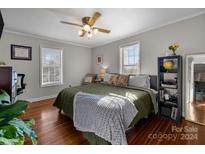 Spacious primary bedroom with hardwood floors and large windows at 325 Mayflower Ave, Cramerton, NC 28032