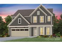 Two-story house with gray siding, beige accents, and a two-car garage at 1048 Kinship Dr # 114, Lancaster, SC 29720