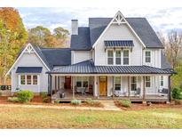 Two-story farmhouse with wraparound porch and landscaping at 785 Ormand Rd, York, SC 29745