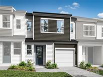 Two-story townhome with dark brown accents and white siding at 2131 Endeavor Run, Charlotte, NC 28269