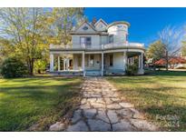 Victorian home with wrap-around porch at 307 Kings Mountain St, Clover, SC 29710