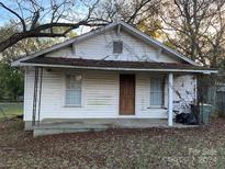 Front view of a small white house with a covered porch at 495 Carver St, Kannapolis, NC 28083