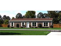 Single-story home with brown siding and landscaping at 210 Sailwinds Rd, Mooresville, NC 28115