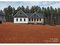 Craftsman style home with white siding, dark gray roof, and a front porch at 1451 Glasscock Rd # 9, Rock Hill, SC 29730