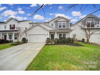 Two-story house with white siding, gray accents, and a grassy lawn at 3073 Cedric Ct, Fort Mill, SC 29715