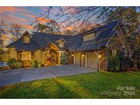 Stunning two-story house with stone accents and a three-car garage at 169 Rimmer Farm Rd, Troutman, NC 28166