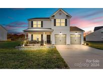 Two-story house with gray accents, double garage, and landscaped lawn at 113 Dublin Ct, Statesville, NC 28677