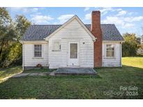 Charming one-story home with a brick chimney and spacious yard at 130 E Branch Ave, Shelby, NC 28152