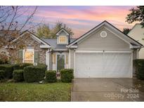 Front view of charming ranch home with double garage at 105 Ranlo Ave, Gastonia, NC 28054