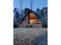 A-frame house with a large window and deck at 2484 Shelton Ave, Statesville, NC 28677
