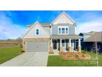 Two story home with gray siding, stone accents and landscaping at 8024 Plymouth Dr, Sherrills Ford, NC 28673