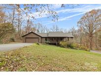 Ranch home with attached garage and large yard at 143 Ponokah Ln, Statesville, NC 28677