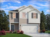 Two-story house with gray siding, white accents, and a two-car garage at 4020 Bufflehead Dr, Charlotte, NC 28269