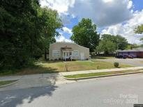 Tan home with front yard, landscaping, and driveway at 416 Locust St, Rock Hill, SC 29730