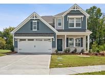 Two-story house with gray siding, white trim, and a two-car garage at 1050 Bull Dog Ln, Wingate, NC 28174