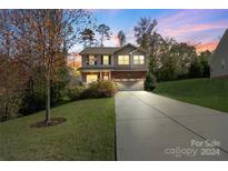 Two-story brick home with a driveway and landscaped yard at 2202 Chickasaw Loop, Rock Hill, SC 29732