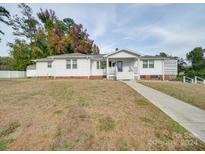 Charming single story home with a well-maintained lawn and walkway at 504 N Pine Ln, Wadesboro, NC 28170