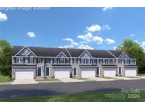 New townhome community with attached garages and landscaping at 7315 Childress Sw Dr, Concord, NC 28025