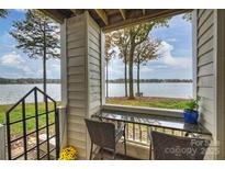 Lakefront balcony with seating area at 907 Southwest Dr, Davidson, NC 28036