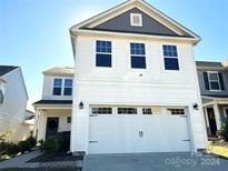 Two-story house with white siding, gray accents, and a two-car garage at 533 Copes Ct, Kannapolis, NC 28081