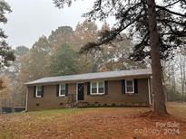 Brick ranch house with a spacious yard and mature trees at 48844 Hidden Rd, Norwood, NC 28128