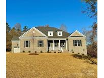 Brick house with a two-car garage and front porch at 3850 Willow Grove Ln # 24, Concord, NC 28025