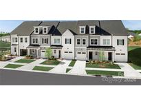 New townhouses with modern gray and white exterior, landscaped lawns, and attached garages at 3030 Finchborough Ct # 232, Charlotte, NC 28269