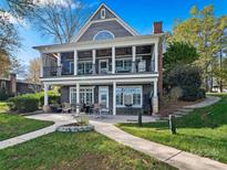 Two-story lakefront home with large deck and patio at 134 Balmoral Dr, Mooresville, NC 28117