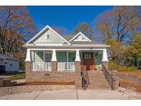 Charming craftsman style home with brick accents and a welcoming front porch at 1721 Pegram St, Charlotte, NC 28205