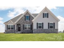 Two-story house with stone accents and a gray exterior at Lot 51 Watercourse Way # Arcadia, Belmont, NC 28012