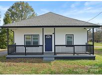 Charming white house with a front porch and dark accents at 3332 York Hwy, Gastonia, NC 28052