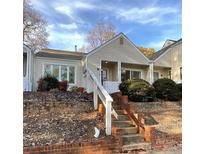 Inviting exterior of charming condo with brick steps and landscaping at 213 Eastwood Dr, Salisbury, NC 28146