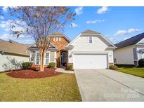 Beautiful ranch-style home with a two-car garage and landscaping at 2221 Hartwell Ln, Fort Mill, SC 29707